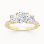 Classic Round Three Stone Engagement Ring in yellow gold, front view