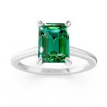 Emerald cut solitaire emerald engagement ring in white gold, front view