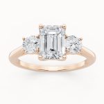 Emerald & Round Three Stone Engagement Ring in rose gold, front view