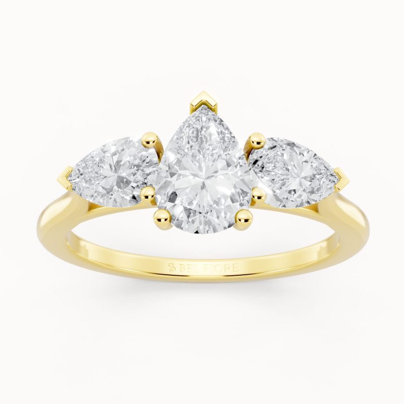 Pear Cut Three Stone Engagement Ring in yellow gold, front view